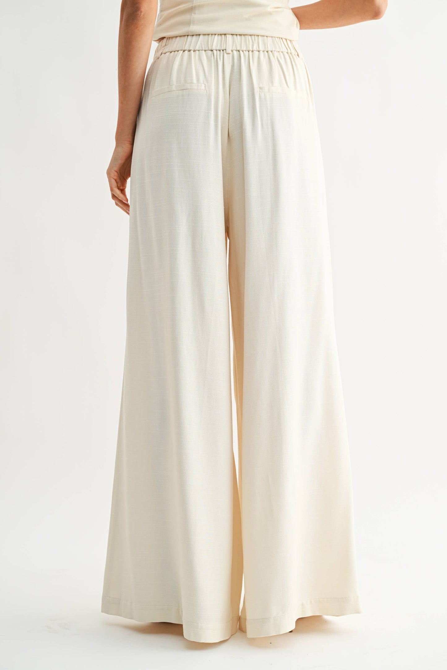 Wide-Leg Pleated Trousers: CREAM